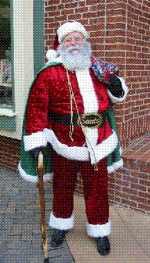 Goodness, Santa Joe is ready for photos anywhere he goes!  This picture was taken at the national Santa Claus Convention for the Amalgamated Order of Real Bearded Santas in Branson, Missouri in 2006.  He does get further north than Naples, Florida but it's rare.